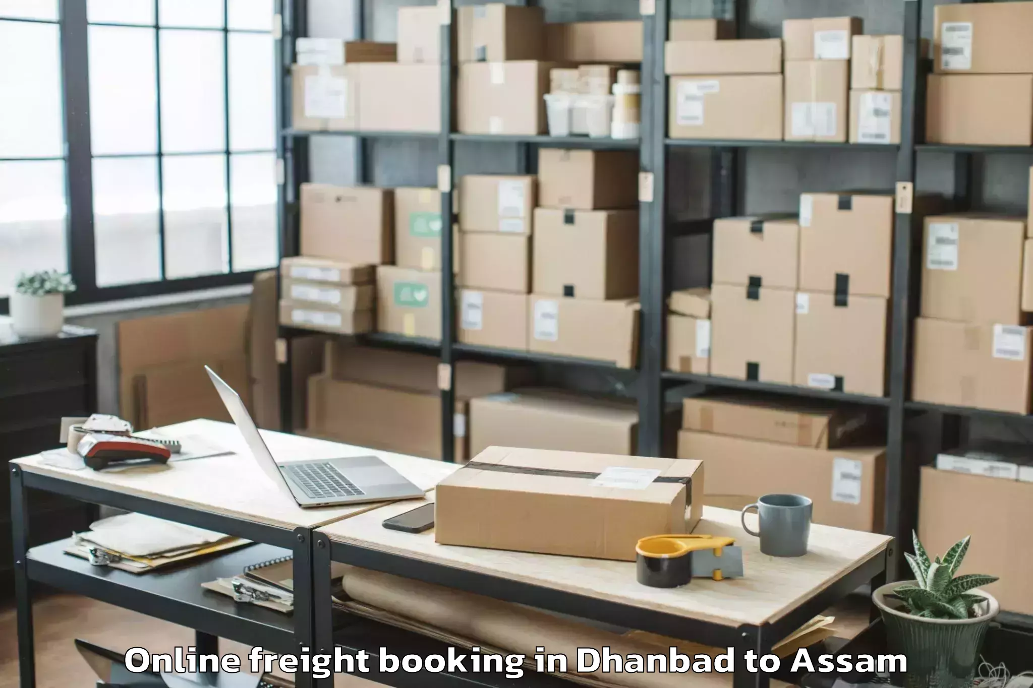 Trusted Dhanbad to Sonabarighat Online Freight Booking